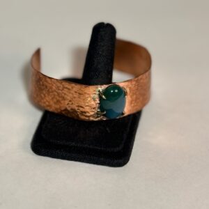 Hammered copper bracelet with stone
